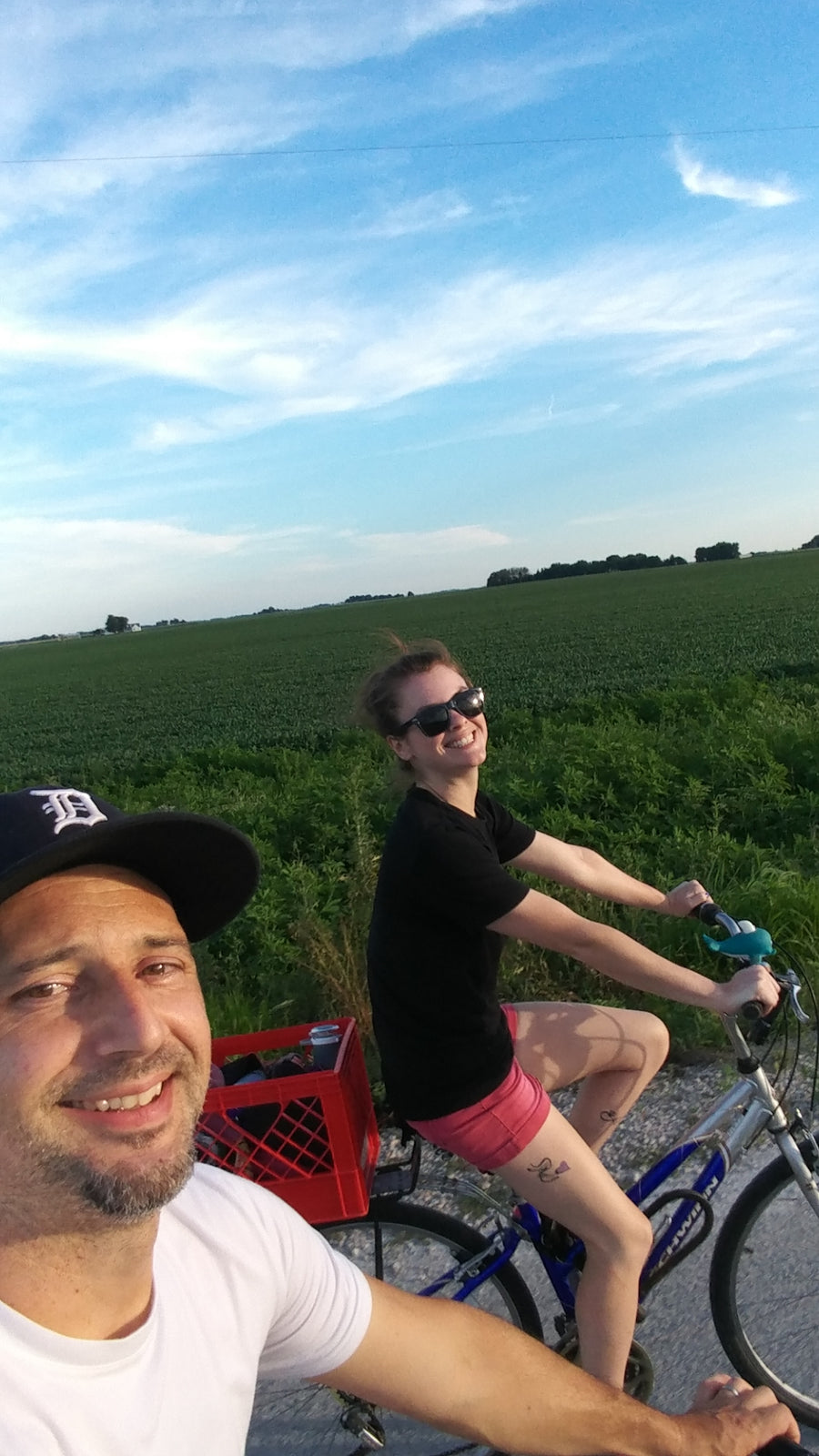 Amanda and Justin riding bikes through the Illinois countryside