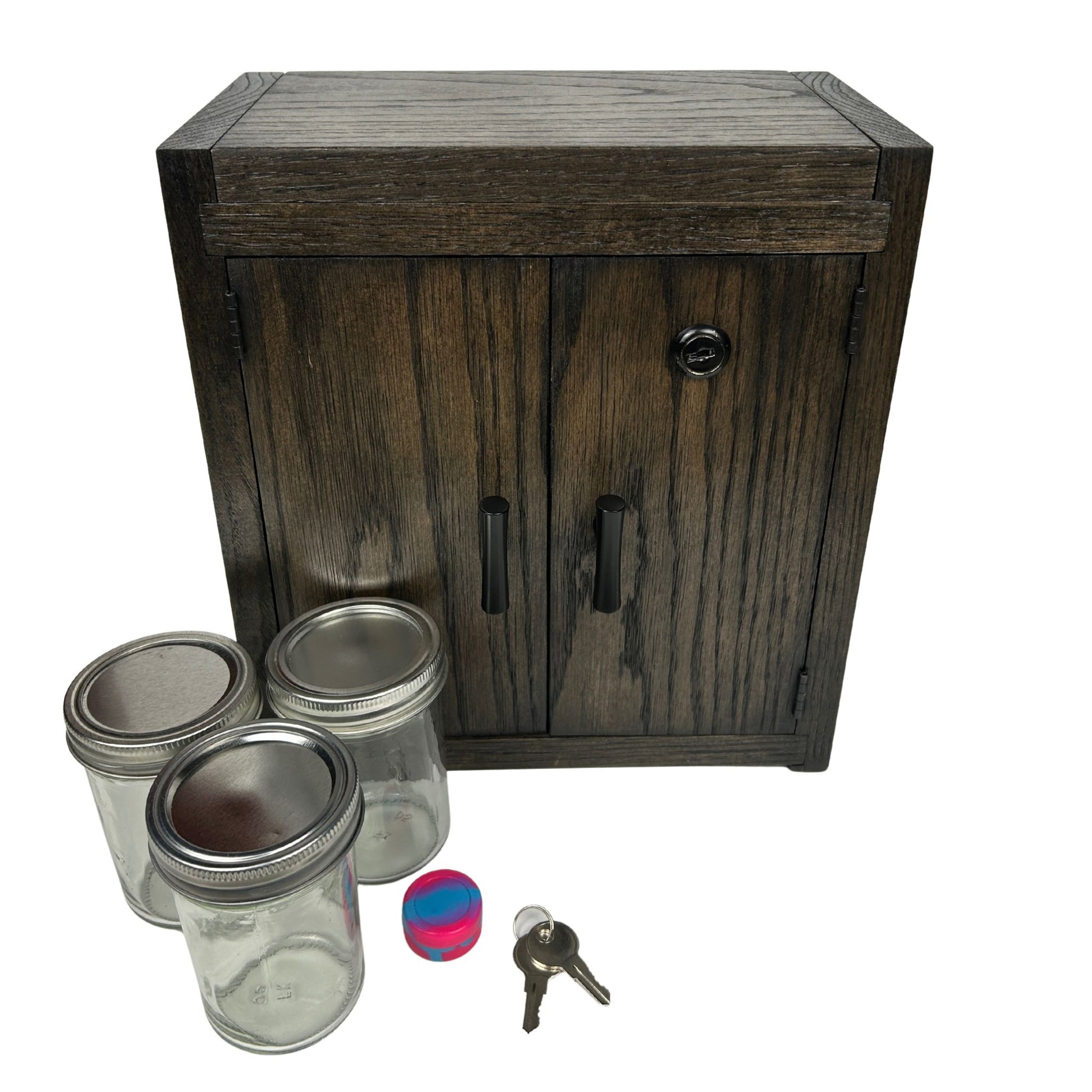 Wooden cabinet lockable stash box with glass jars, a key, and a colorful silicone jar on a white background
