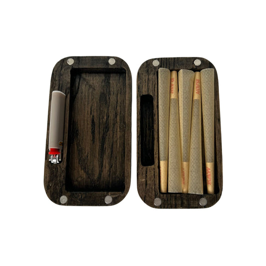 A handcrafted oak pre-roll holder designed as Travel Accessories, neatly storing pre-rolls and a mini lighter in one compact case.